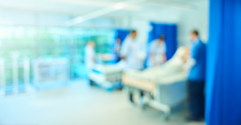 Doctors and nurses seeing patient at a warm inside a hospital