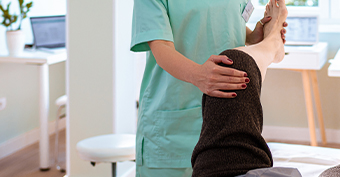 orthopaedic doctor in their surgery treating a patient