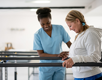 Nurse helping patient in hospital