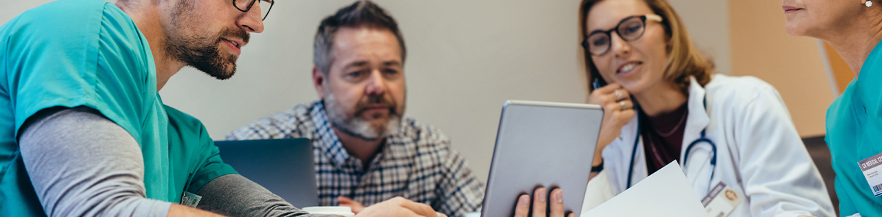 Doctor showing other staff in the hospital how to prevent brain injuries and death of babies during childbirth