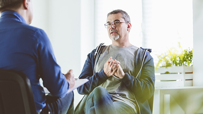 Psychiatrist talking to patient