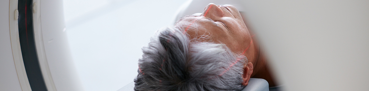 Man getting a CT scan for his brain tumour