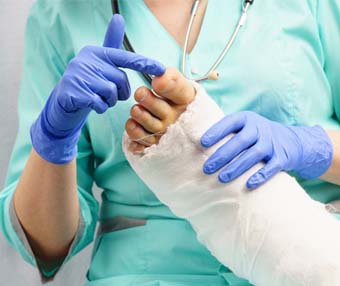 Nurse wrapping patient's foot after they had foot surgery