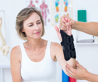Woman getting treatment for her hand after a hand injury