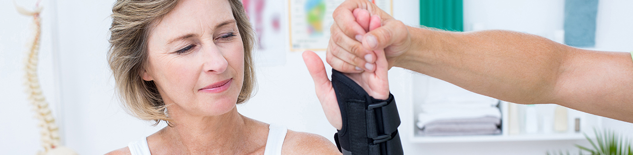 Woman getting treatment for her hand after a hand injury