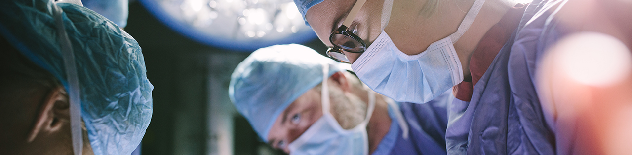 Surgeons performing a surgery on a patient in a hospital