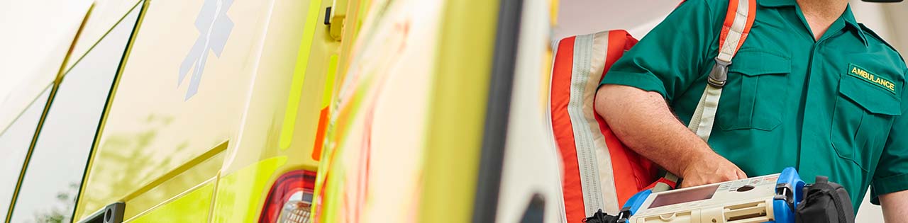 Paramedic on dutry walking out of an ambulance