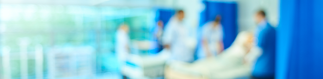 Doctors and nurses seeing patient at a warm inside a hospital
