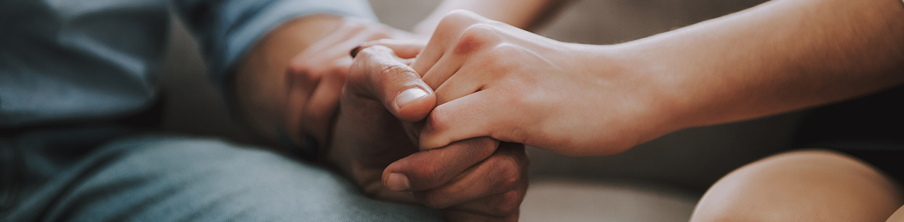 Two people holding hands