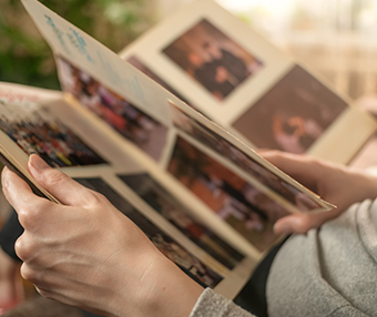 Person looking through a book of family pictures