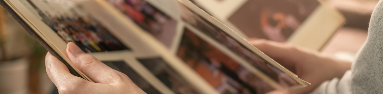 Person looking through a book of family pictures