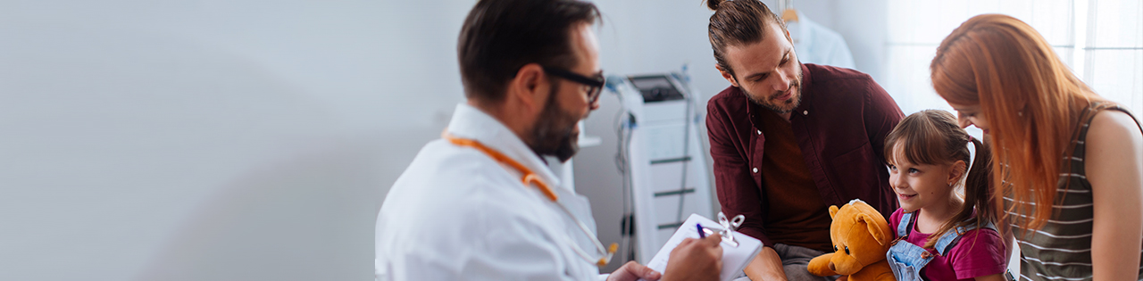 A doctor discussing a child's health with their family, providing medical advice and support.