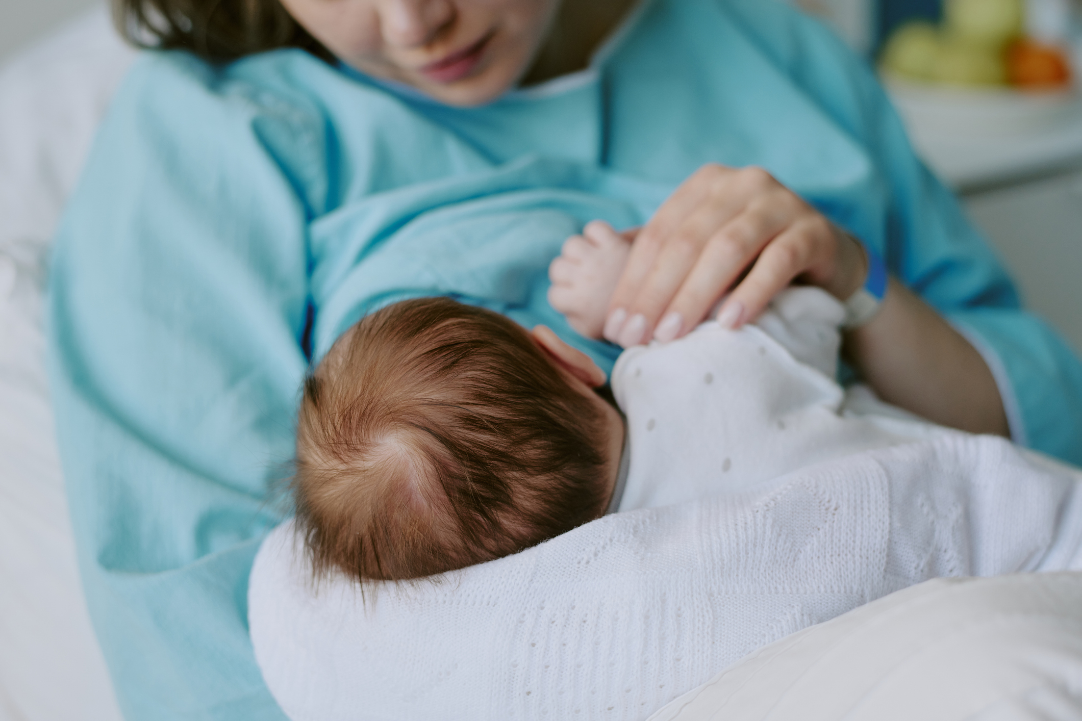 A photo of a nurse with newborn