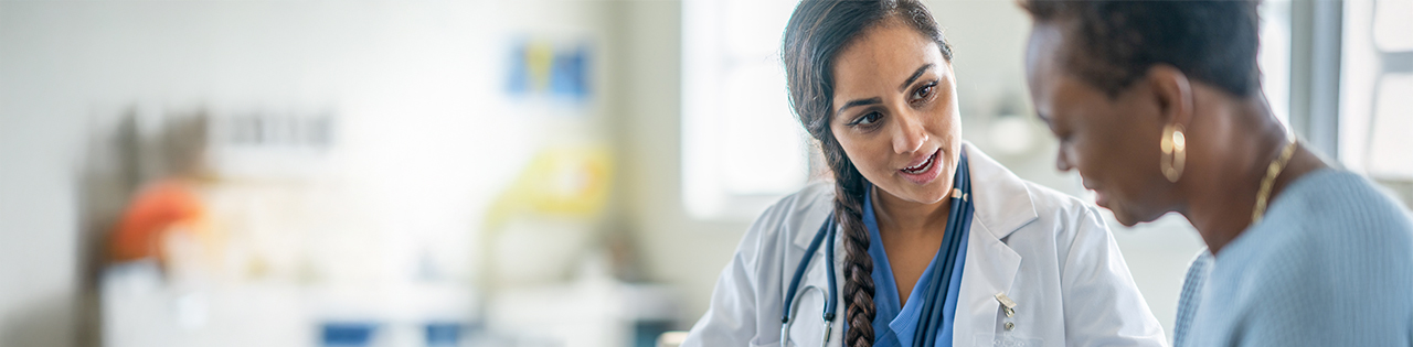 Doctor talking to nurse in an hospital
