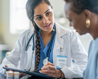 Doctor talking to nurse in a hospital