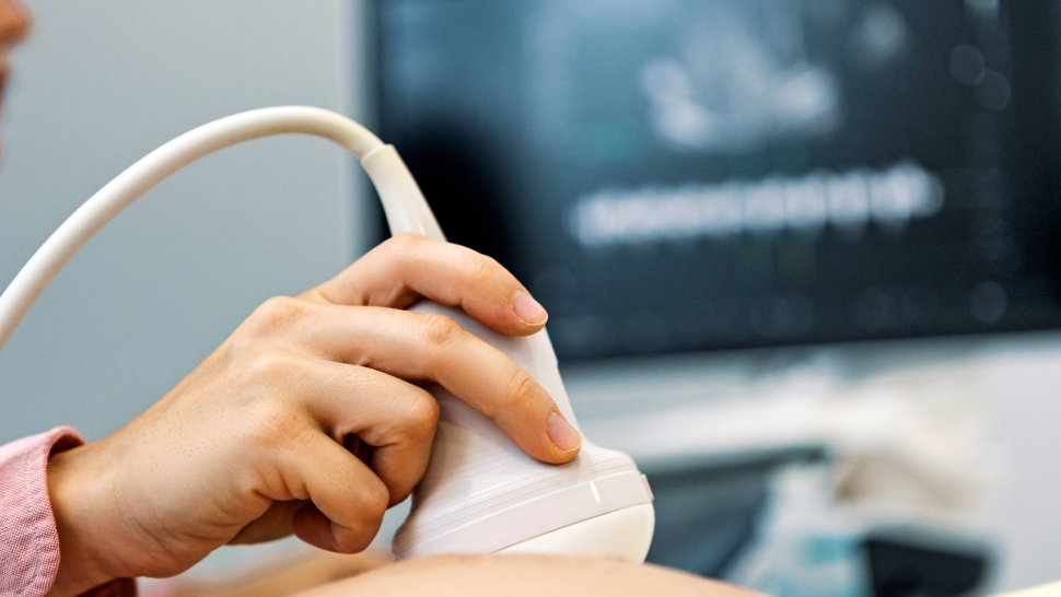 Woman having her stomach scanned